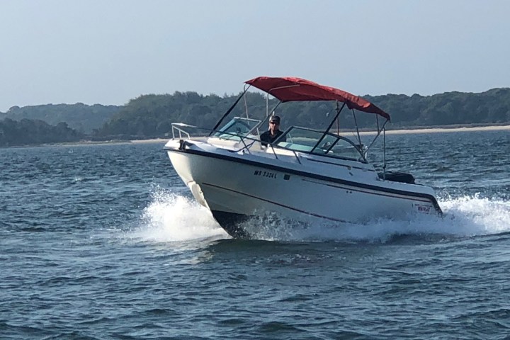 A man driving a boat
