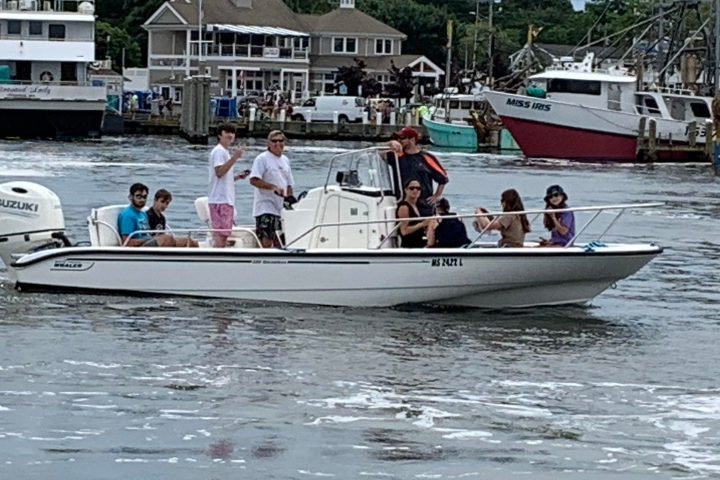 a group of people on a boat in the water