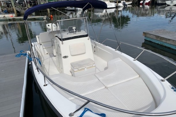 a boat is docked next to a body of water
