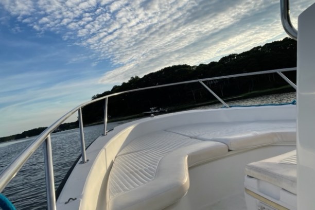 a boat sitting on top of a car